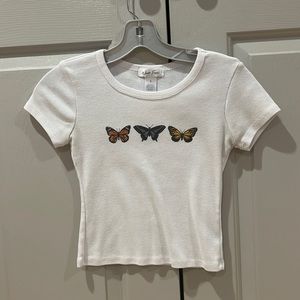 Tilly’s white butterfly fitted top